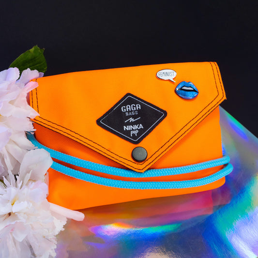 Orange bag (cyan + black/white strap)