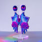 Large purple tropical flower dangles